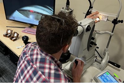 Optometrist practising SLT